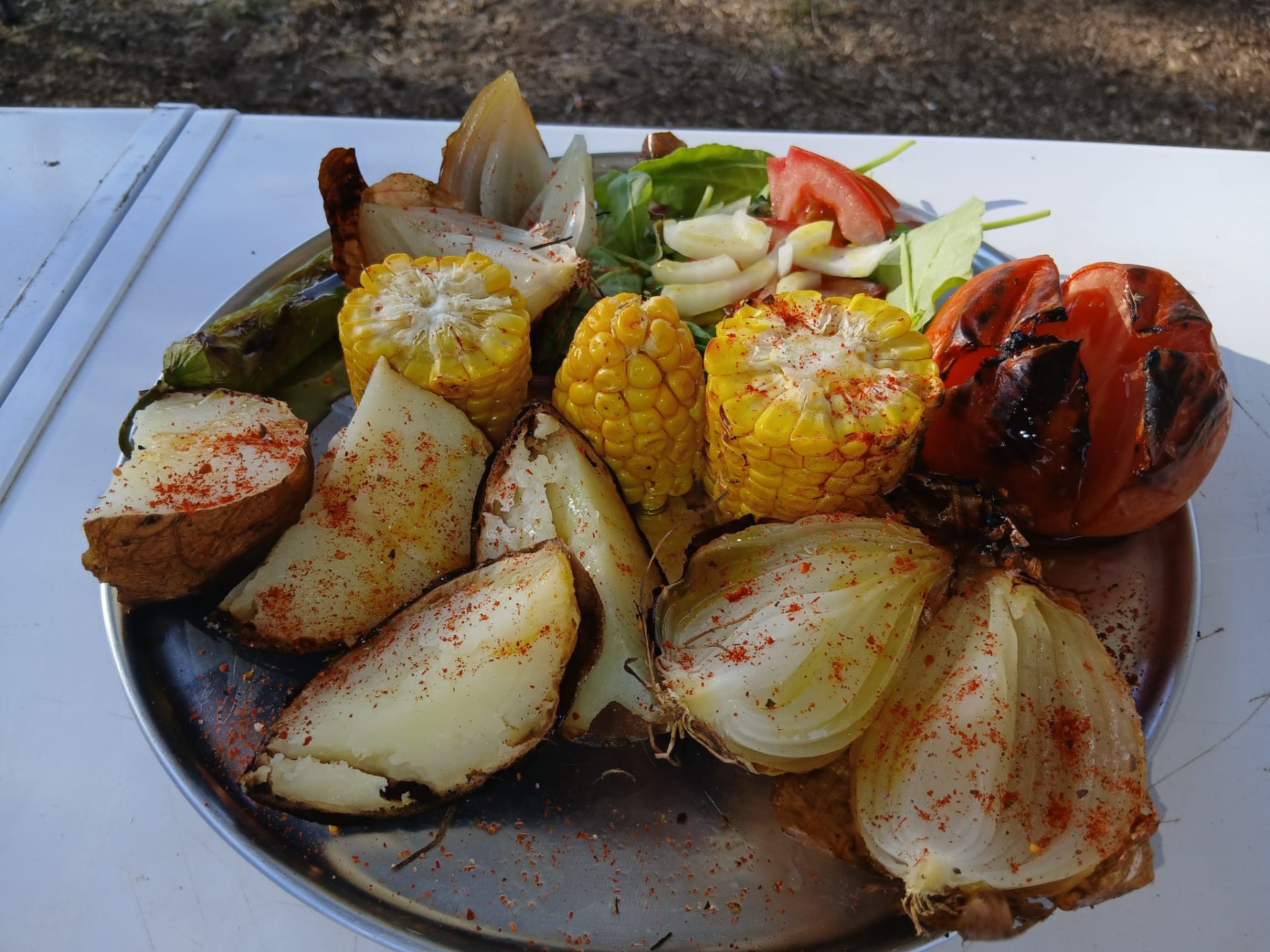 Grilled corn, potatoes, onions and tomato
